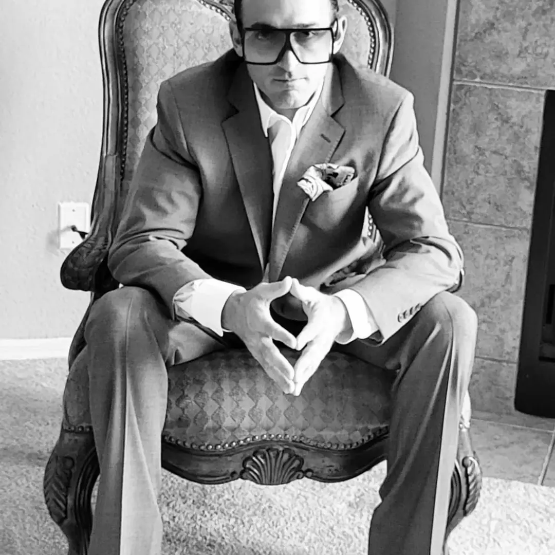 Dean Edward Riggs in a tailored suit